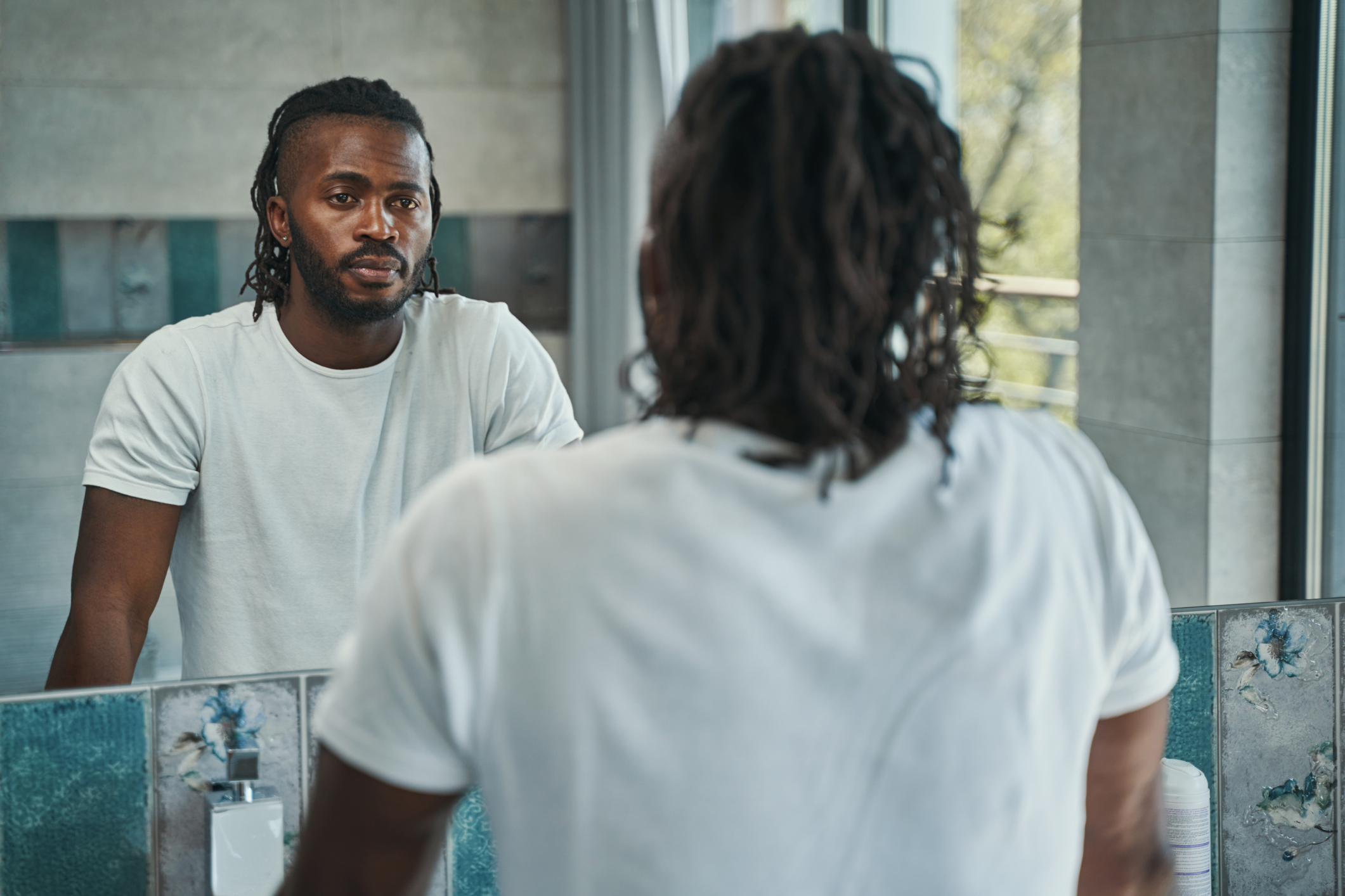 man looking in mirror