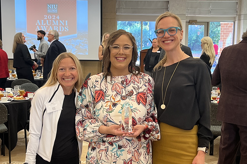 Abby Jeppson (center) was joined at NIU award ceremony with her fellow SRAlab SLP Elissa Larkin (right) and her mentor, Dr. Jamie Mayer (right)