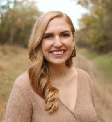 photo of Emily Dinelli, a young white woman with long blonde hair wearing a tan sweater