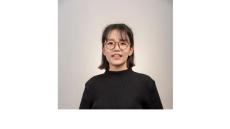 photo of Heerak Choi, a young Korean woman with black hair and glasses wearing a black shirt