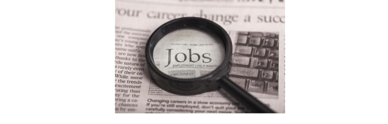 photo of a magnifying glass over text that says jobs