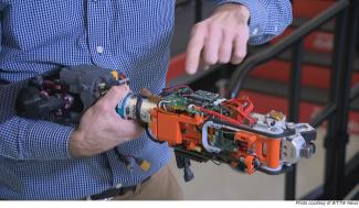 Research Engineer Frank Ursetta showing one of the bionic legs developed at Shirley Ryan AbilityLab.