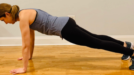 Therapist demonstrating correct push-up form