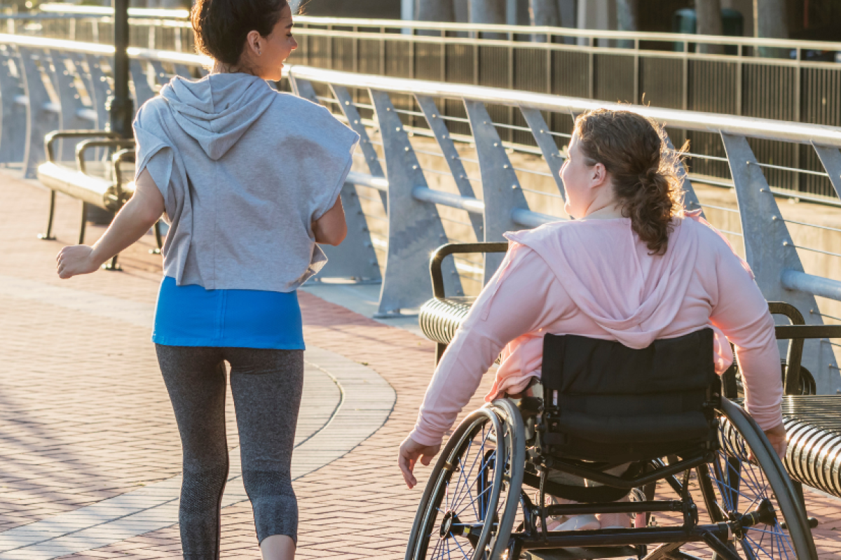 Wheelchair user exercising with their friend