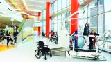 Patient participates in physical therapy on a treadmill.