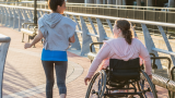 Wheelchair user exercising with their friend 